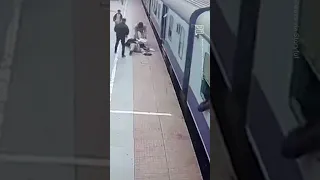Passenger Narrowly Avoids Being Pulled Away Train in India