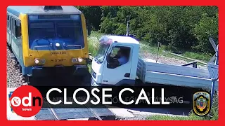 Terrifying Moment Train Hits Truck on Tracks in Hungary