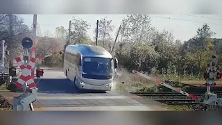 Bus Driver Catches Red Light At Level Crossing And Smashes Past Barriers