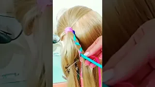 Детская причёска из кос с лентами.
