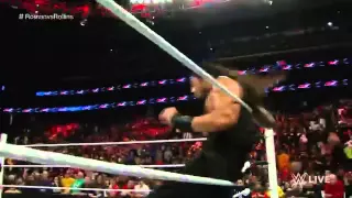 Roman Reigns dives over the top rope!