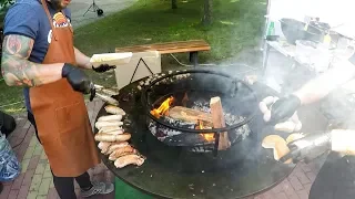 Pork and Chicken Sausages on a Circular Grill. Minsk Street Food, Belarus