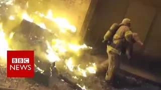 Miracle catch: Firefighter catches child from burning building - BBC News