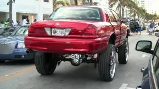 Ford Crown Victoria Lifted high on 30 inch rims with train horns