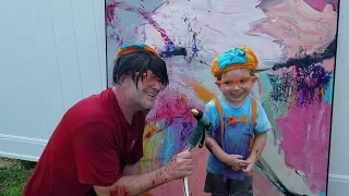Dad dressed as Blippi gets attacked by Blippi dressed toddler son with water hose Paint a Painting