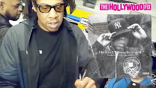 Jay-Z Calls Out A Fan With A Bootleg Album Trying To Get An Autograph While Leaving His Office In NY