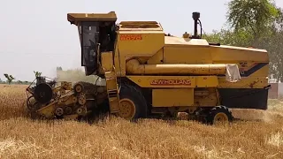 Massive harvesting machine of Punjab.Combiene harvester at work. Campaign machine