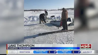 Truck goes through the ice on Lake Thompson