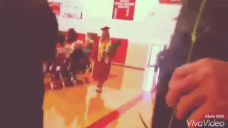 Marine surprises sister at high school graduation.