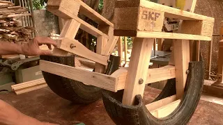 A Rocking Chair Made From Recycled Pallets And Old Tires With A Very Beautiful And Modern Design