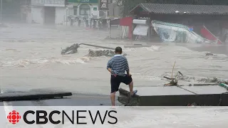 Heavy rain batters Beijing as flooding leaves at least 11 dead