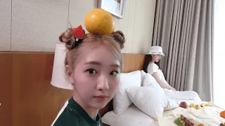 Yeojin smiling with an orange on her head