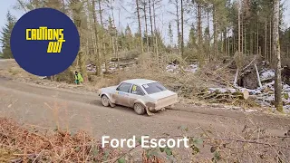 Malcolm Wilson Rally 2023 Ford Escort No 95 driving hard through Grizedale Forest - fans cheering
