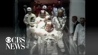 Apollo 11 astronauts wave goodbye as they head to the Saturn 5 rocket