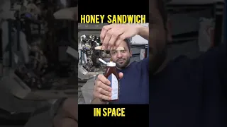Eating honey sandwich  in space.
