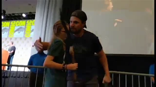 Sarah returns the bow to Stephen Amell at the Arrow panel - SDCC 2019