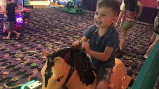 James on a mechanical horse- before quarantine