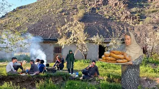 Baking bread:eating lunch,working together,and living in avillage hidden on a sunny day by the river