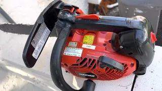 Adjust chain oil output on an Echo chain saw