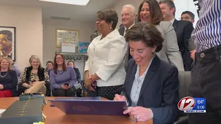 Raimondo signs bill to increase minimum wage in RI