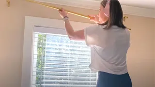 The brilliant reason people are hanging curtain rods (NOT for curtains!)