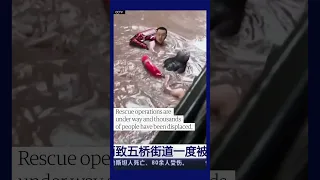 The moment a building collapses during severe flooding in China