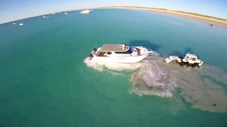 huge trailer boat launched from beach