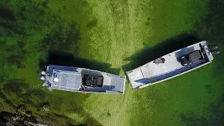 Boats on a collision course to transfer vehicles over open water