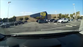 White Honda runs over parking block