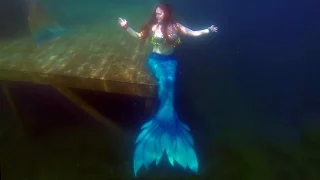 Mermaid Iona swims in a Finfolk Productions silicone mermaid tail