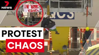 Docks brought to a standstill after protestors chain themselves to giant cranes | 7 News Australia