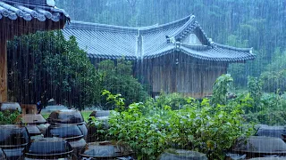Heavy rain falls on a hanok house