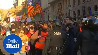 Separatist protesters scuffle with police in Catalan capital