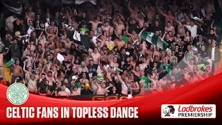 Celtic fans dance topless in the rain!