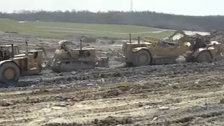 Caterpillar Dual D-9's Pushing Scrapers