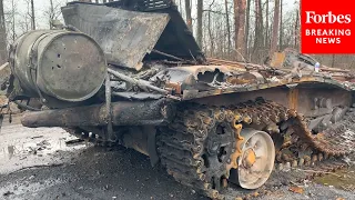 Ukrainian Soldiers Surveil Destroyed Russian Tanks In Bucha, Ukraine