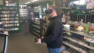 Game store owner tries VR for the first time!