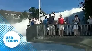 Would you stand this close to a raging waterfall? In Switzerland, they do.