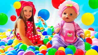 The baby girl cooks a PIE for the baby doll! Kids pretend to play cooking with toys & dolls for kids