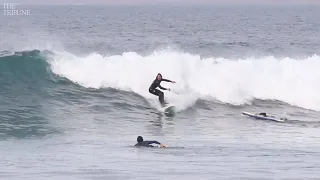 Surfers hit the waves north of Morro Rock