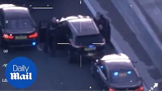 Moment drug dealers are forcibly pinned down on motorway
