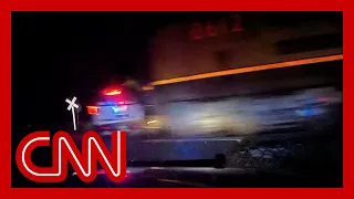 Train hits police vehicle with suspect inside