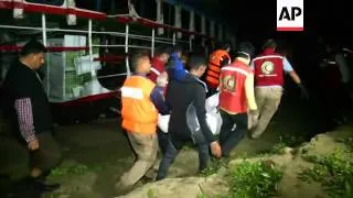 The wreckage of a cross river ferry struck Saturday by a cargo boat was lifted across the Padma Rive