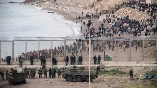 Ceuta: Children among thousands of migrants in desperate swim from Morocco to Spanish enclave