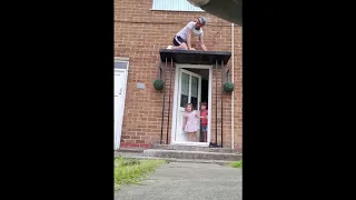 Dad Hiding On Top Door Canopy Pranking Kids With Fake Knocks