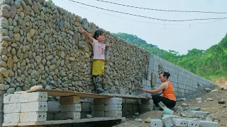 Single mother - Building a retaining wall to prevent landslides, completion stage