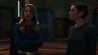 Supergirl looks for a way to reach the people to help the orphans