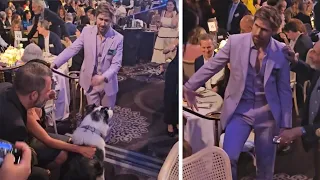 Ryan Gosling meets Messi, who plays Snoop the dog in "Anatomy of a Fall." at Oscars luncheon