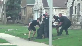 One man fights multiple police officers at same time