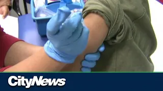 Health officials call for families to get their kids vaccinated amid hospital crisis.